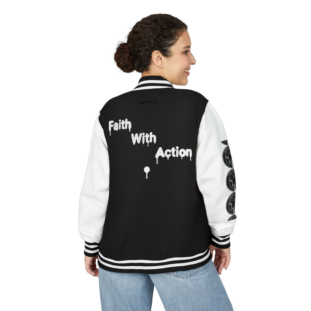 Back view of a woman wearing a black and white Faith In Motion Varsity Jacket with "Faith With Action" text.