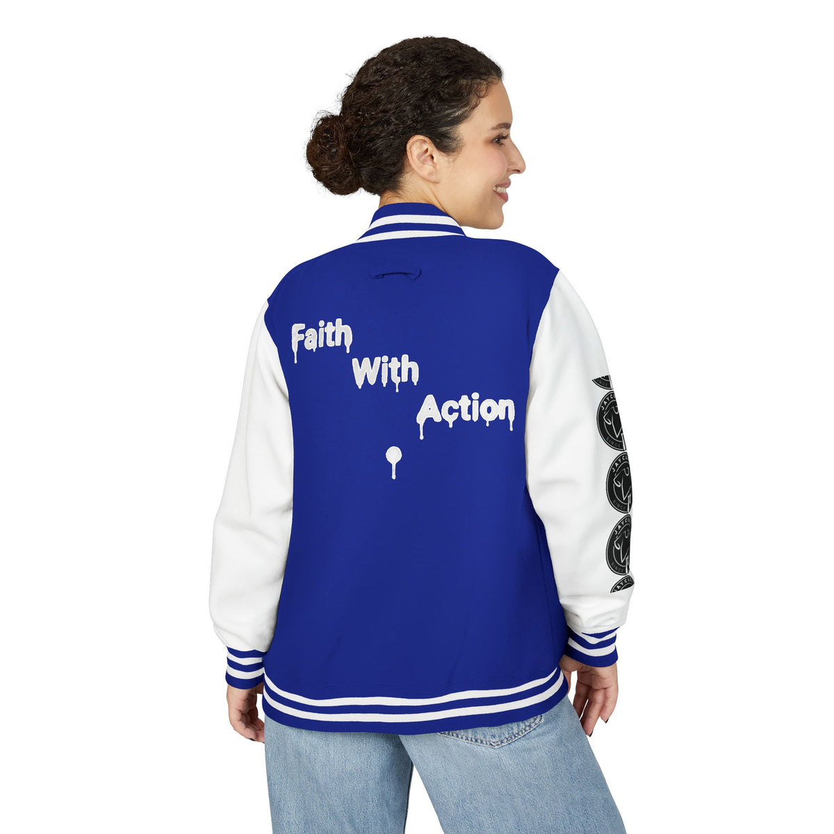 Back view of a woman wearing a blue and white Faith In Motion Varsity Jacket with "Faith With Action" text.